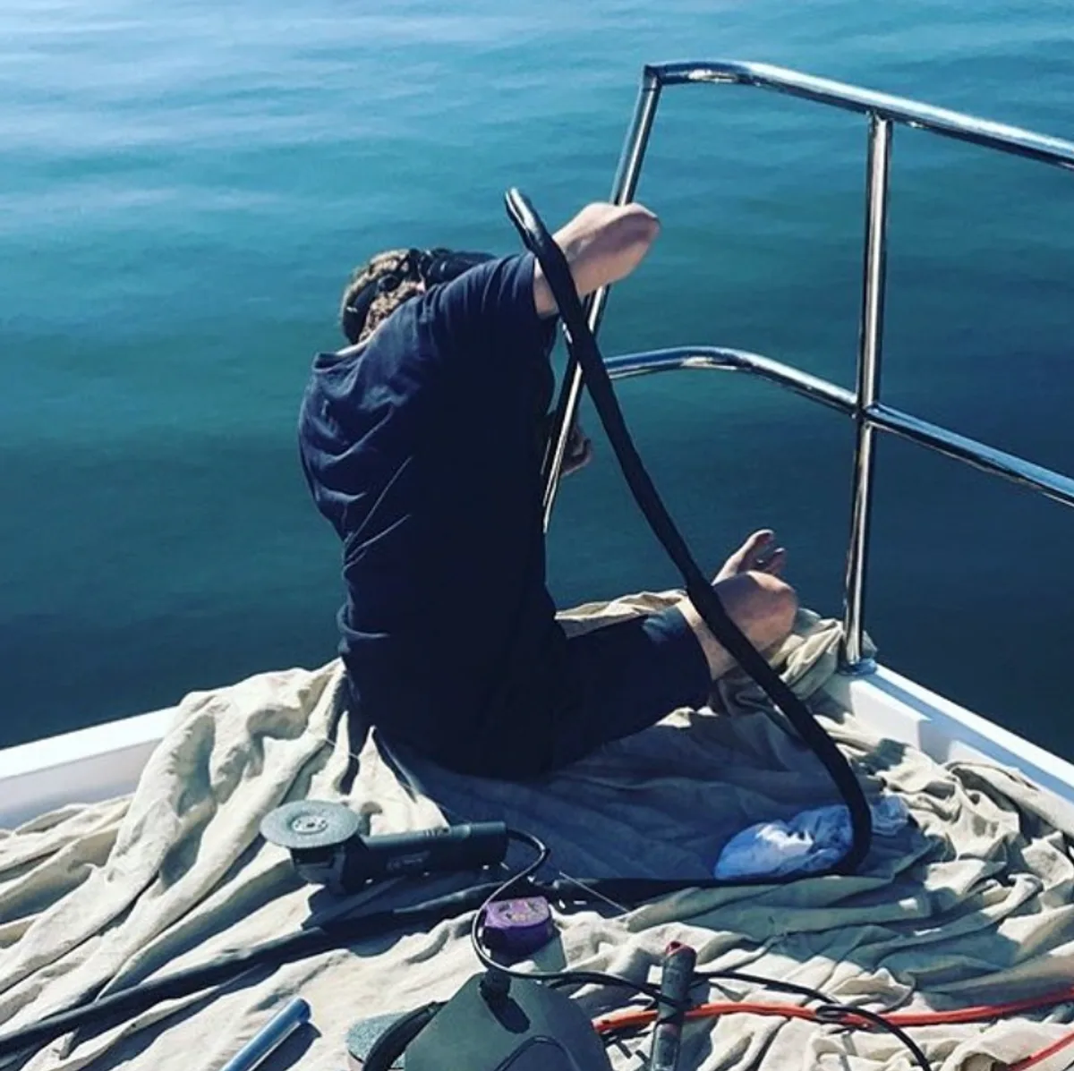 Matt welding a stainless rail on the bow of a super yacht